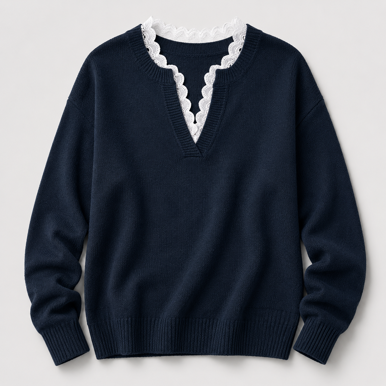 Scalloped V-neck sweater detail